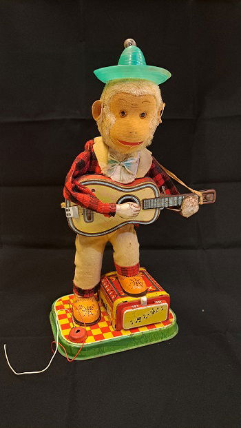 Registro de salida: «Juguete. Mono que toca la guitarra»